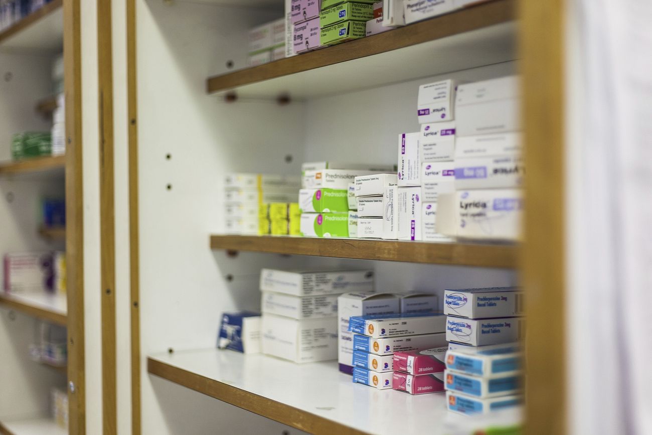 Free medicine boxes stacked on cabinet